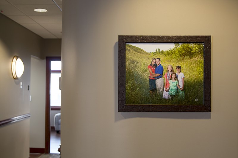 Lakewinds Dental Centre hallway with a framed portrait of Dr. Jason Martin's family